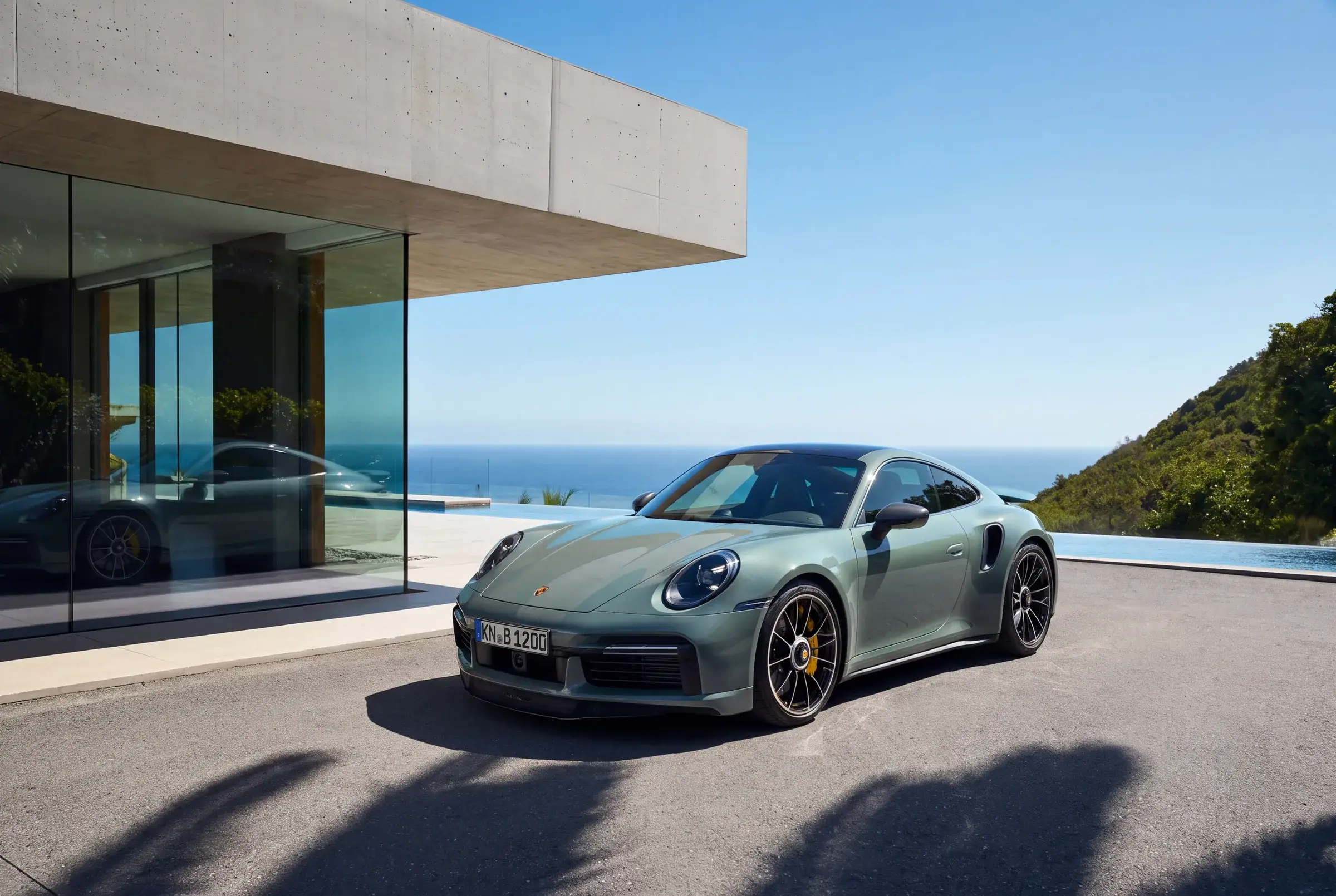 911 Turbo S parked at a glass modernist house